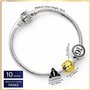 The Carat Shop Harry Potter - Bracelet à Breloques Charms argenté avec Les reliques de la Mort, Vif d'or et Voie 9 3/4-17cm